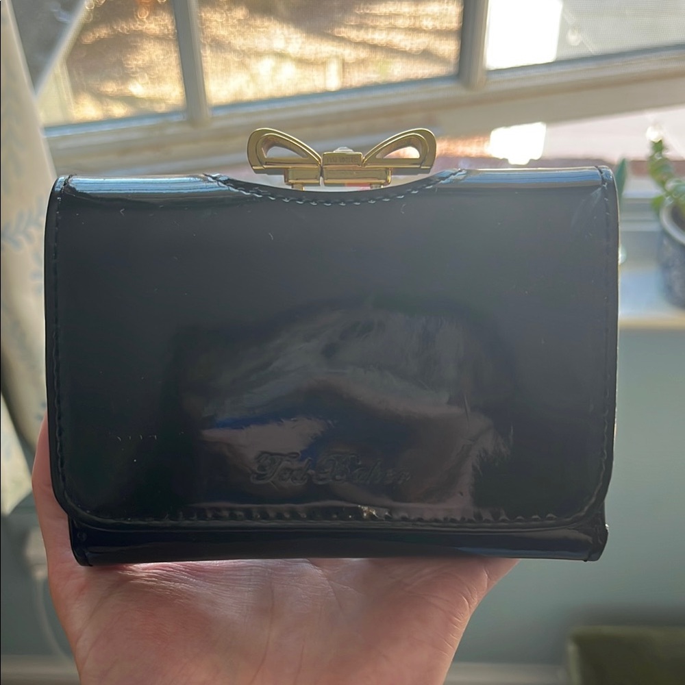 Black Leather Ted Baker Wallet with Gold Bow Accent